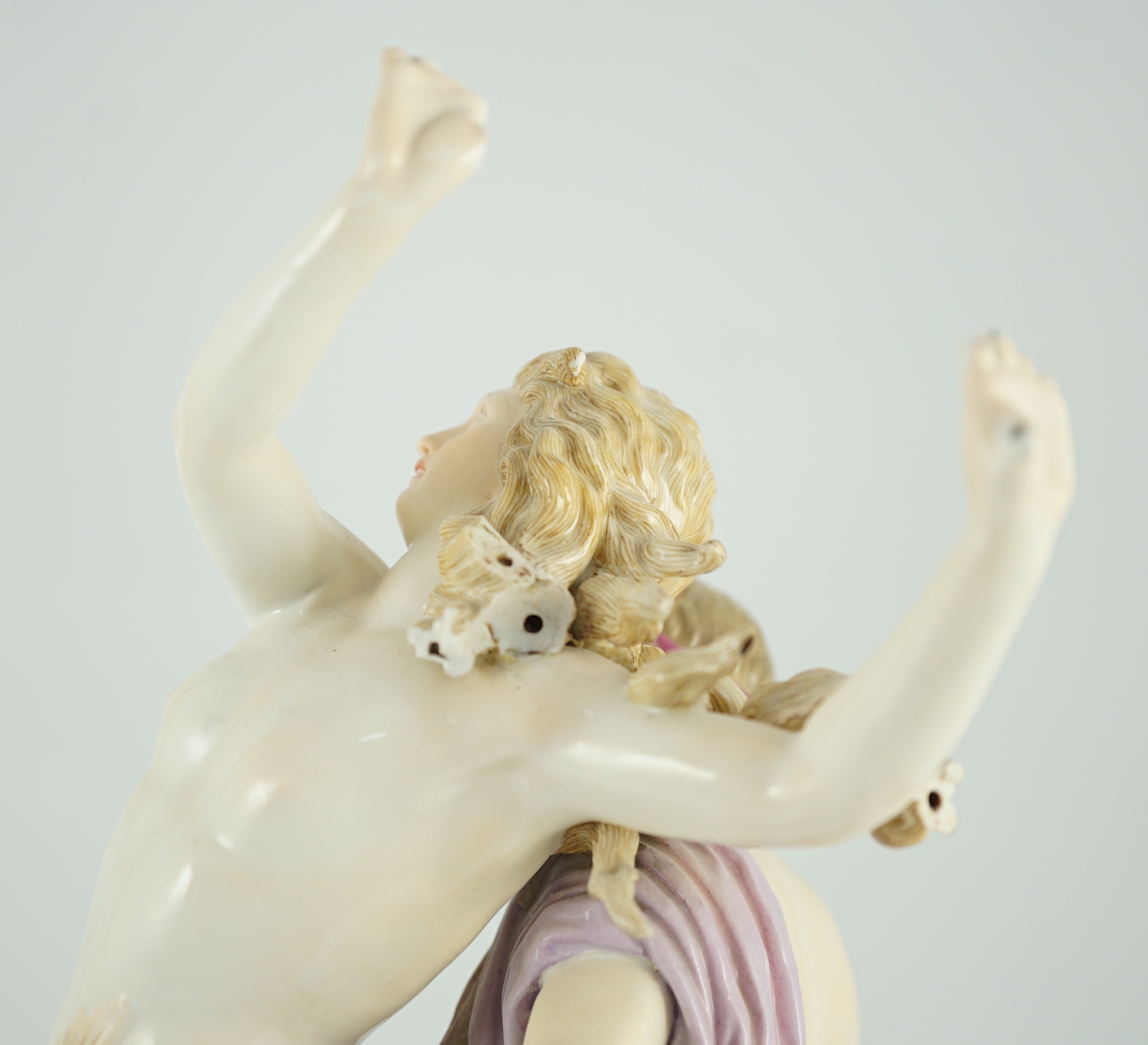 A Meissen allegorical group of Apollo and Daphne, 19th century, 36cm high, losses to hands and hair